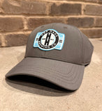 Grey hat with plastic patch